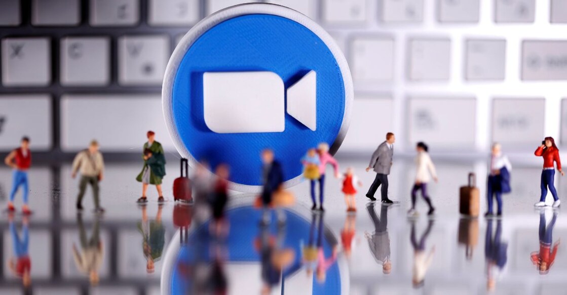 A 3D printed Zoom logo is placed between small toy people figures and a keyboard in this illustration taken April 12, 2020. Photo: Reuters/Dado Ruvic/Illustration