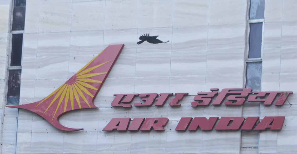 A bird flies over a logo of Air India airlines at the corporate headquarters in Mumbai, India, October 19, 2021. File photo: Reuters/ Francis Mascarenhas