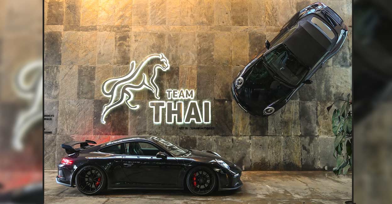 01 The 2005 model Porsche Carrera adorns the wall of the head office of Team Thai business group.