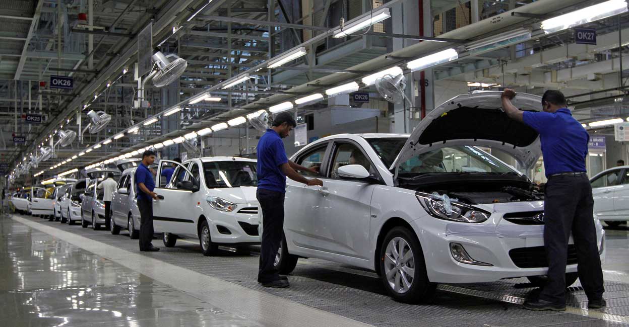 Workers assemble cars inside the Hyundai Motor India Ltd. plant at Kancheepuram. File Photo: Reuters/Babu