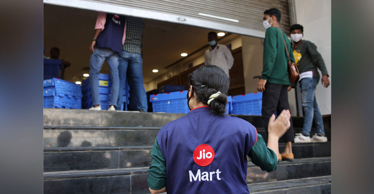 How Reliance stunned Amazon in battle for Future Retail A woman wearing a Reliance JioMart vest instructs workers as they stock their products inside a Future Retail's closed Big Bazaar retail store in Mumbai, March 2, 2022. Picture taken March 2, 2022. Photo: REUTERS/Francis Mascarenhas