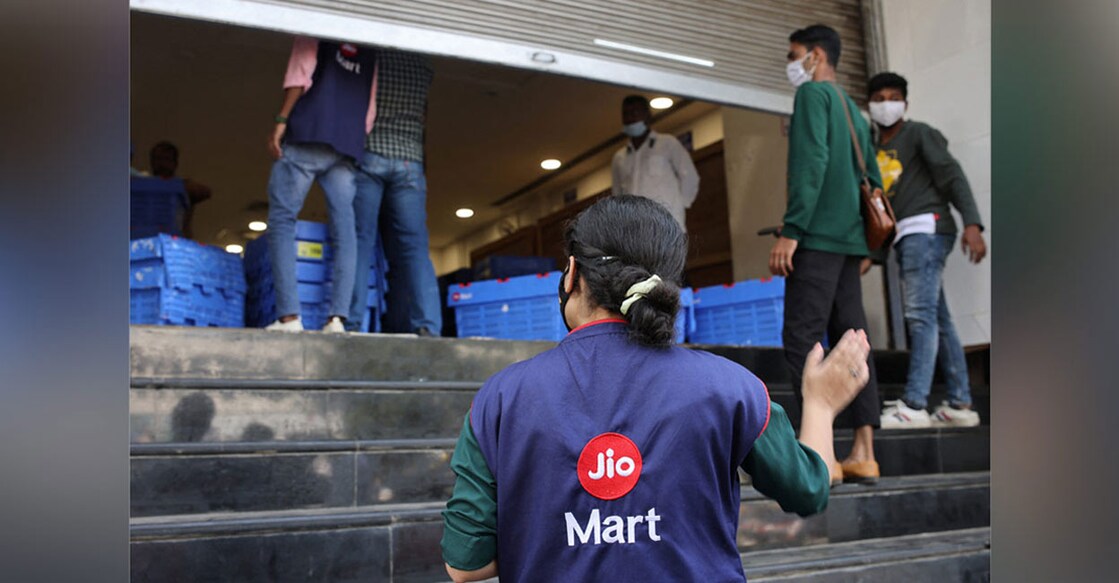 How Reliance stunned Amazon in battle for Future Retail A woman wearing a Reliance JioMart vest instructs workers as they stock their products inside a Future Retail's closed Big Bazaar retail store in Mumbai, March 2, 2022. Picture taken March 2, 2022. Photo: REUTERS/Francis Mascarenhas