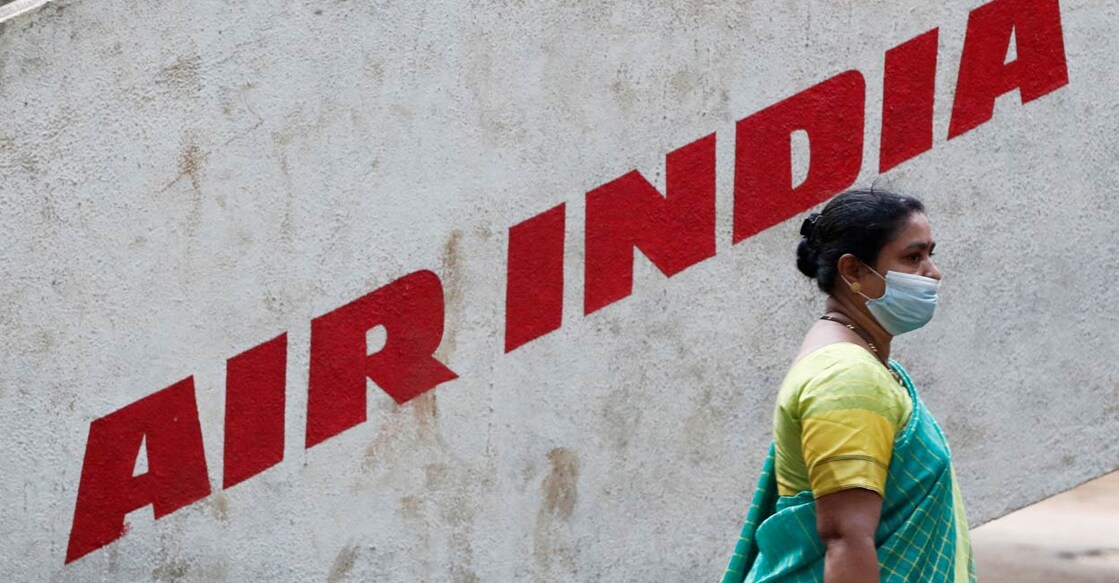 A woman walks past Air India airlines branding at a park in Mumbai, India, October 19, 2021. PHOTO: Reuters/Francis Mascarenhas