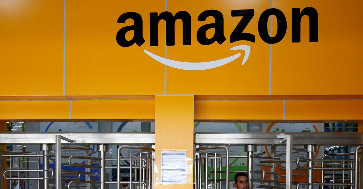 An employee of Amazon walks through a turnstile gate inside an Amazon Fulfillment Centre (BLR7) on the outskirts of Bengaluru, India, September 18, 2018. Photo: Reuters/Abhishek N. Chinnappa