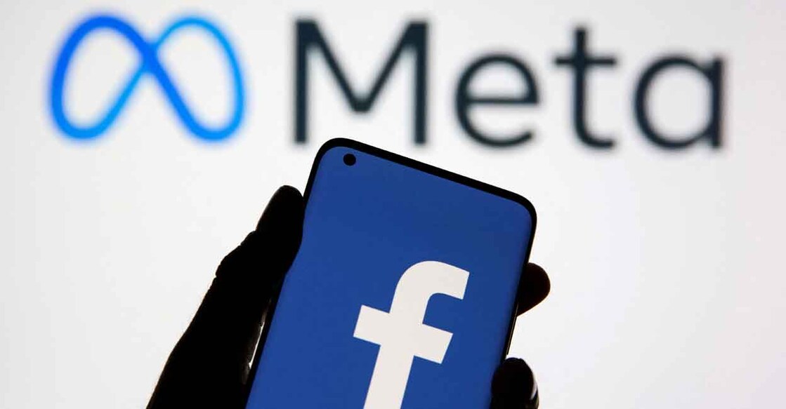 FILE PHOTO: A smartphone with Facebook's logo is seen in front of displayed Facebook's new rebrand logo Meta in this illustration taken October 28, 2021. REUTERS/Dado Ruvic/Illustration/