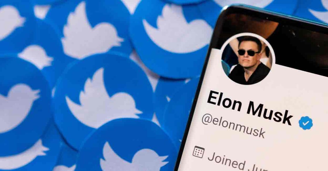 Elon Musk's Twitter profile is seen on a smartphone placed on printed Twitter logos in this picture illustration taken April 28, 2022. REUTERS/Dado Ruvic/Illustration