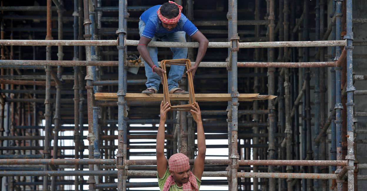Labourers work at the construction site of a residential building on the outskirts of Kolkata: REUTERS/Rupak De Chowdhuri/Files