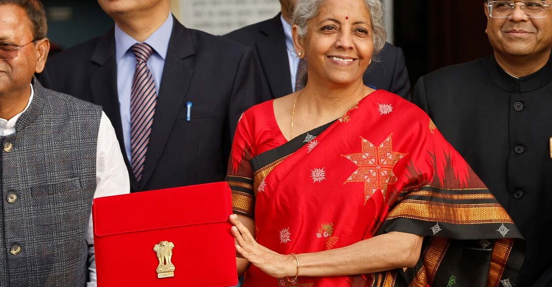 Finance Minister Nirmala Sitharaman holds up a folder with the Government of India's logo as she leaves her office to present the Union Budget 2023 in the parliament, in New Delhi, February 1, 2023. Photo: REUTERS/Adnan Abidi