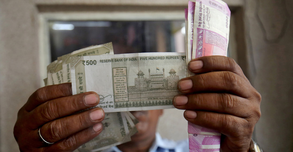 A cashier checks Indian rupee notes inside a room at a fuel station in Ahmedabad, India, September 20, 2018. File photo: REUTERS/Amit Dave