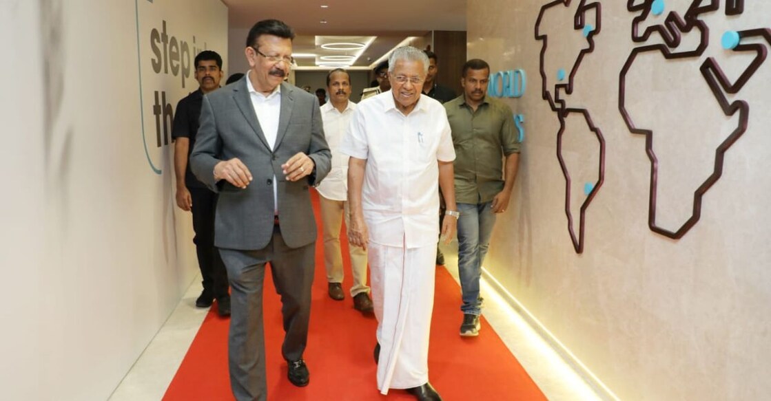 Chief Minister Pinarayi Vijayan is given a tour of IBS Software's second fully-owned campus in Infopark near Kochi on Sunday. Seen with him is the company’s founder and executive chairman V K Mathews. Photo: Special arrangement