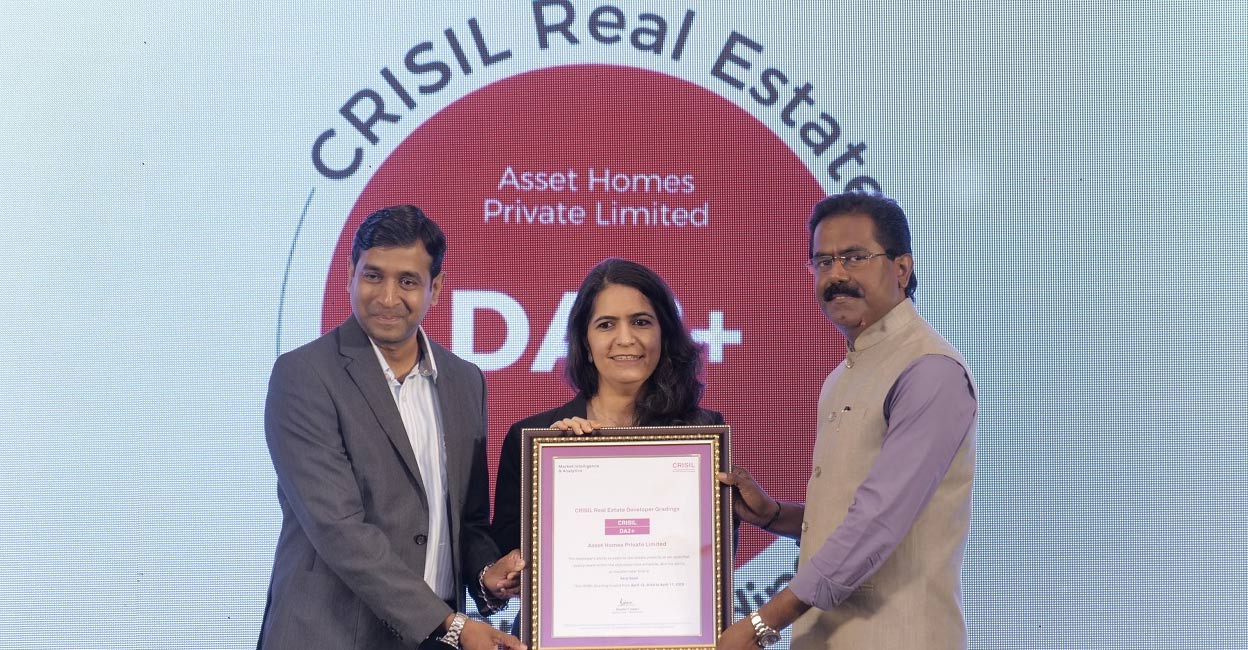 Binaifer Jehani, business head, CRISIL and Abbas Master, associate director, CRISIL, present Sunil Kumar V, founder & managing director, Asset Homes, with the CRISIL DA2+ certification at a function in Kochi. Photo: Special arrangement.