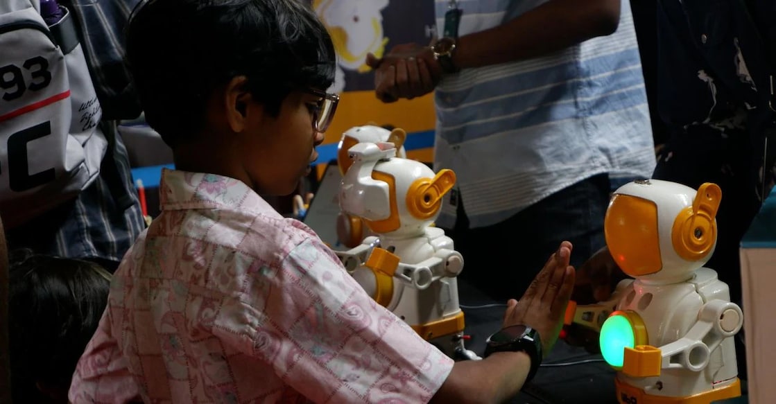 Children playing and interacting with robots showcased at the Roboverse VR Expo. Photo: Manorama.