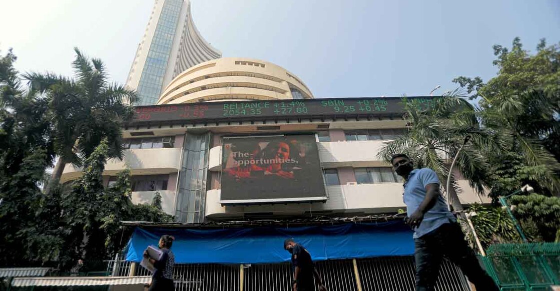 FILE PHOTO: People walk past the Bombay Stock Exchange (BSE) building in Mumbai, India, November 4, 2020. REUTERS/Francis Mascarenhas/File Photo