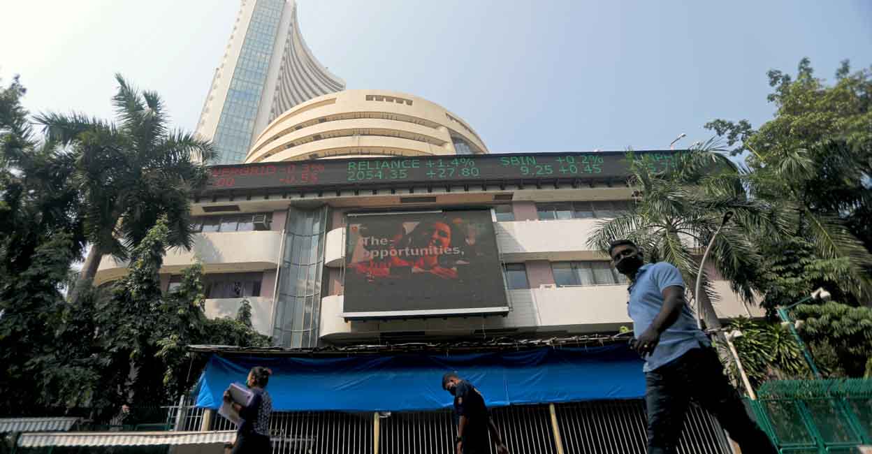 FILE PHOTO: People walk past the Bombay Stock Exchange (BSE) building in Mumbai, India, November 4, 2020. REUTERS/Francis Mascarenhas/File Photo