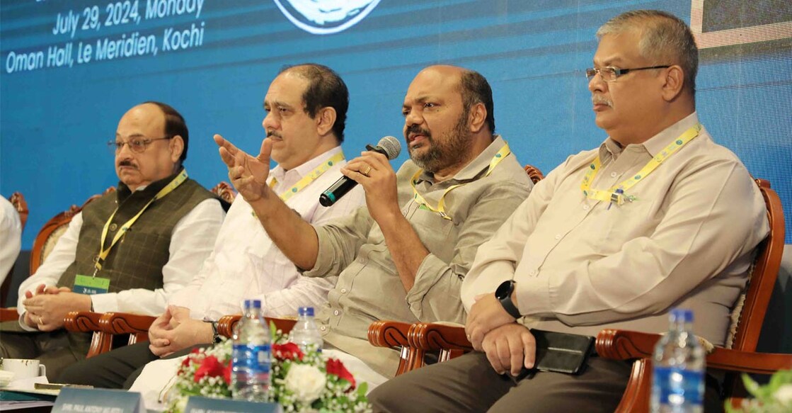 Minister for Industries, Law and Coir P Rajeeve interacts with investors at the ‘Conclave on Continuing Investments’ in Kochi on Monday. Also seen are FICCI Co-Chairman (Kerala State Council) Deepak Aswani, Principal Secretary (Industries) APM Mohammed Hanish, and KSIDC Chairman Paul Antony. Photo: Special arrangement.