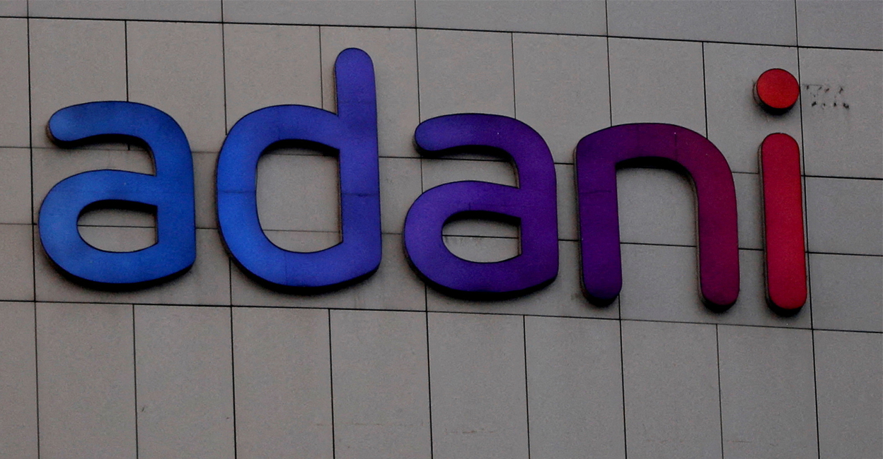 adani group The logo of the Adani Group is seen on the facade of its Corporate House on the outskirts of Ahmedabad, India, January 27, 2023. REUTERS/Amit Dave/File Photo