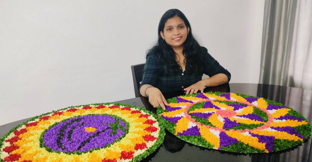 Besty Thomas with her artificial Pookalam. Photo: Special Arrangement