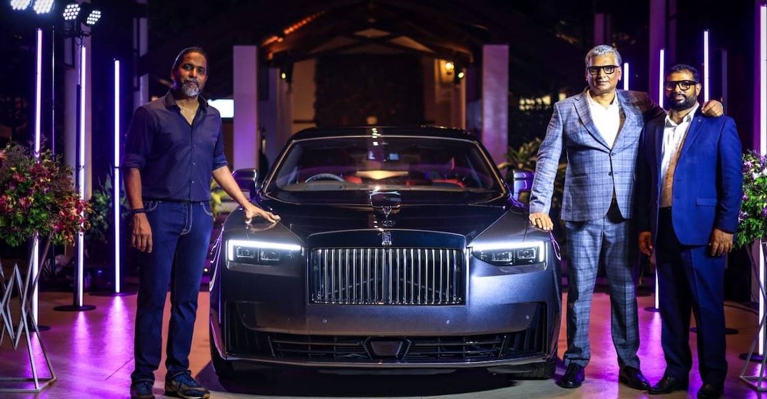 rolls-royce-kochi Venu Gopalakrishnan (left) with the newly delivered Rolls-Royce Black Badge Ghost Series II after receiving the key from Hitesh Naik and Collin Elson of KUN Exclusive. Photo: Special arrangement