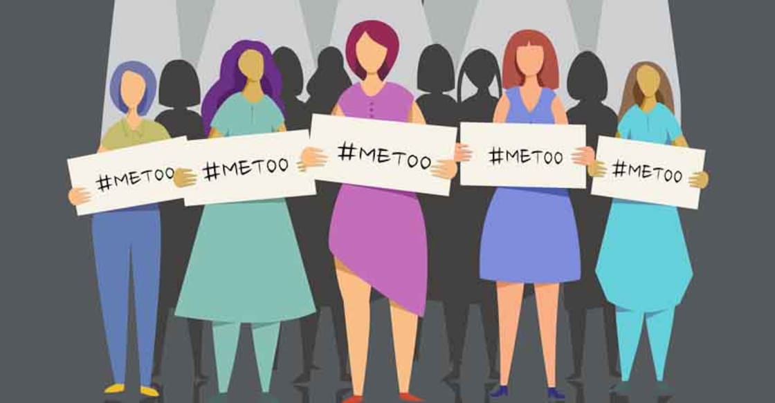 me-too-group A group of women come out from dark holding 'me too' placards