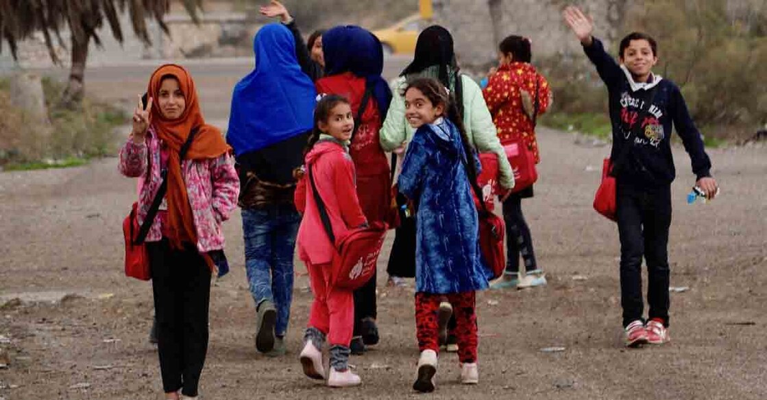 Baghdad, Dec. 30, 2018 (Xinhua) -- Displaced children leave for home after one day's study on the "Hope Bus" in Baghdad, capital of Iraq, on Dec. 27, 2018. At a forgotten slum in the southeast of Baghdad, capital of Iraq, a glimmer of hope shines in the hearts and minds of dozens of internal displaced children as a nongovernmental organization (NGO) turned a large old bus into a mobile school. It is named "Hope Bus," the seats of which were removed and replaced with school desks for as many as 50 pupils, and was furnished with colorful curtains, loudspeakers, a television set and a blackboard. The children in the bus use the same textbooks at the government schools. They are taught reading, writing, arithmetic, science and English letters. They also receive psychological support, and practise sports or artistic activities in the field where the bus stops.(Xinhua/Khalil Dawood/IANS) Baghdad, Dec. 30, 2018 (Xinhua) -- Displaced children leave for home after one day's study on the "Hope Bus" in Baghdad, capital of Iraq, on Dec. 27, 2018. At a forgotten slum in the southeast of Baghdad, capital of Iraq, a glimmer of hope shines in the hearts and minds of dozens of internal displaced children as a nongovernmental organization (NGO) turned a large old bus into a mobile school. It is named "Hope Bus," the seats of which were removed and replaced with school desks for as many as 50 pupils, and was furnished with colorful curtains, loudspeakers, a television set and a blackboard. The children in the bus use the same textbooks at the government schools. They are taught reading, writing, arithmetic, science and English letters. They also receive psychological support, and practise sports or artistic activities in the field where the bus stops.(Xinhua/Khalil Dawood/IANS)