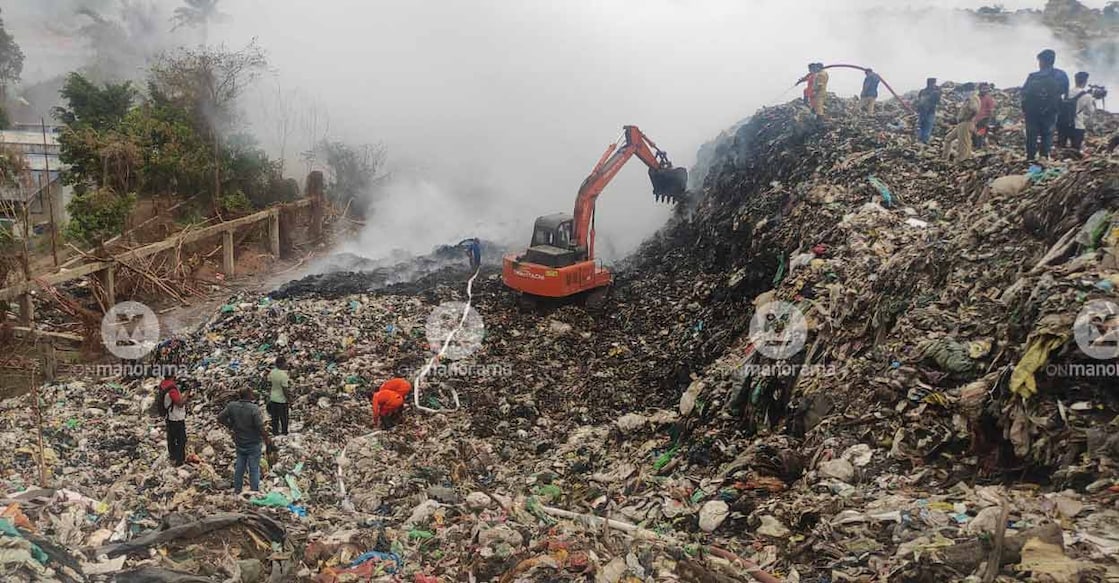 Fire & Rescue personnel working to put out the fire at Brahmapuram waste dump yard on Sunday. Photo: Manorama