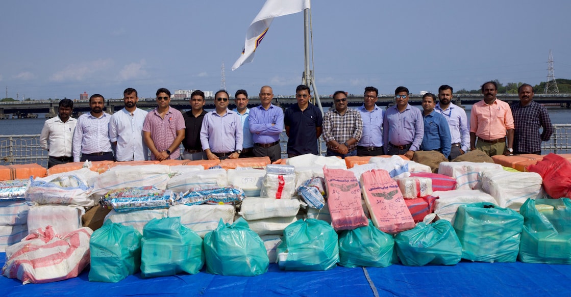 NCB, Navy officers pose in front of the contraband seized from an unnamed vessel. Photo: Special arrangement