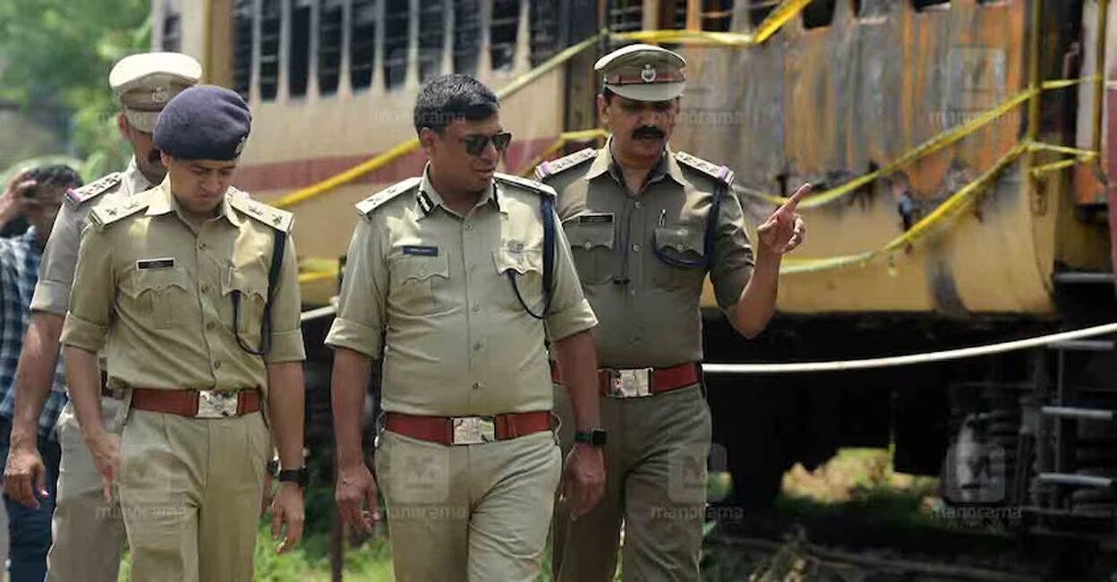 kannur-train-fire-ig-neeraj-kumar-gupta A police team led by IG Neeraj Kumar Gupta (centre) inspects the Executive Express that was gutted in a fire near the Kannur Railway Station. Photo: Manorama