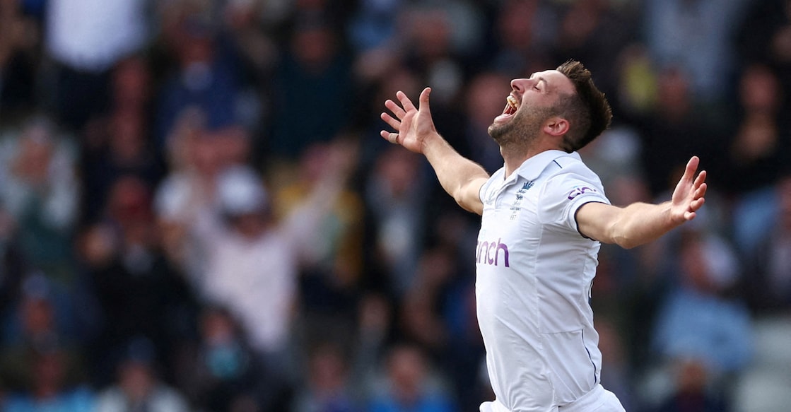 England's Mark Wood celebrates after taking the wicket of Australia's Travis Head. Photo: Reuters/Andrew Boyers
