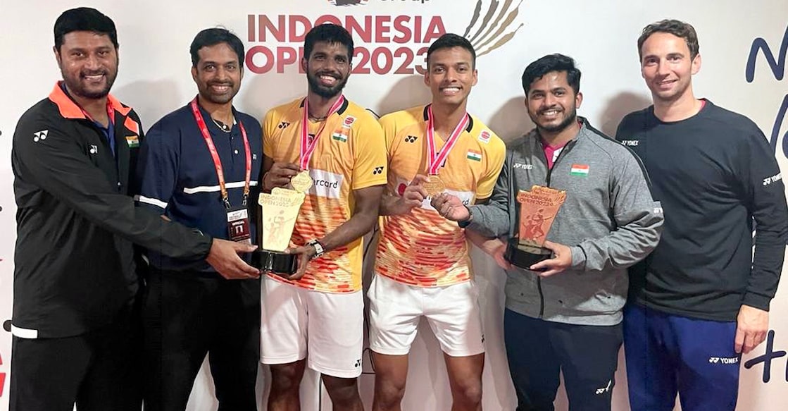 Satwiksairaj Rankireddy and Chirag Shetty with coaches Pullela Gopichand and Mathias Boe and suppor staff, Ganesh Achary and Kiran C. Photo: Twitter/@BAI_Media