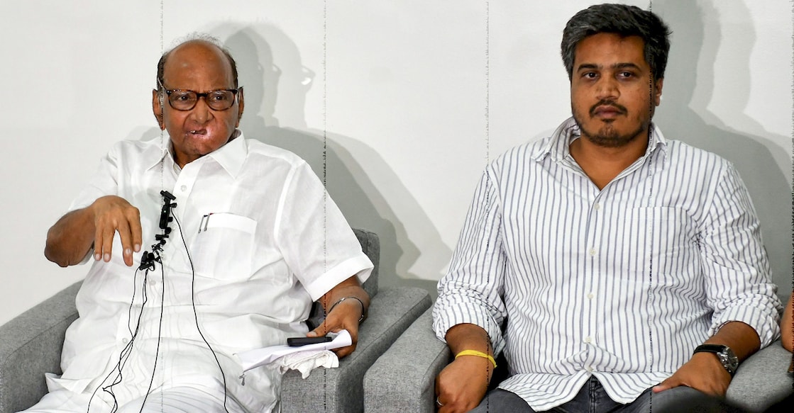 Nationalist Congress Party (NCP) President Sharad Pawar with party MLA Rohit Pawar speaks during a press conference at his residence in Pune on Sunday. Photo: PTI