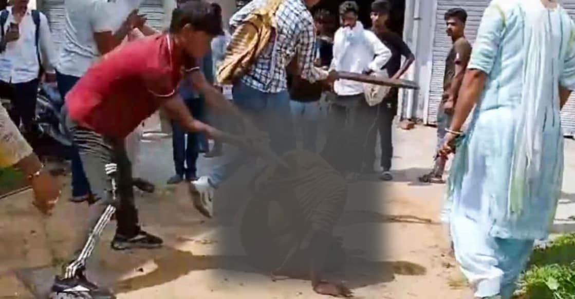 A screengrab shared by PTI shows people beating a man (blurred) over suspicion of eating beef, in Charkhi Dadri district, Haryana on Saturday. 