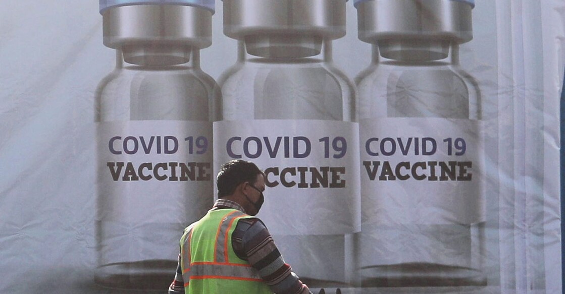 A ground staff walks past a container kept at the Cargo Terminal 2 of the Indira Gandhi International Airport, which according to the officials will be used as a COVID-19 vaccine handling and distribution center, during the media preview in New Delhi, India December 22, 2020. REUTERS/Anushree Fadnavis?/File Photo