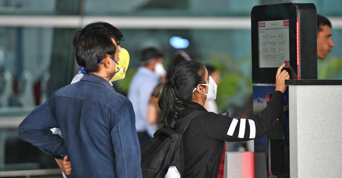Passengers seen wearing masks as a precautionary measure against COVID-19 (Coronavirus) at the Indira Gandhi International Airport in New Delhi on March 15, 2020. (Photo: IANS)