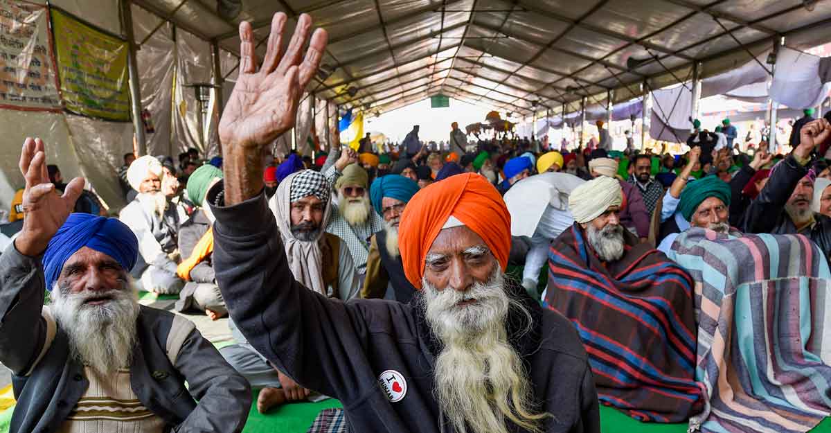 PTI01_21_2021_000090A Farmers during their ongoing protest against the Centre's new farm laws, at Singhu border in New Delhi. PTI