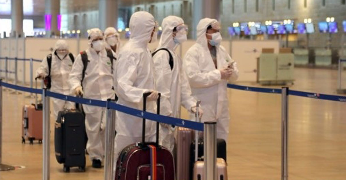 Israel: Passengers wearing protective suits and masks are seen at Ben Gurion International Airport near Tel Aviv, Israel, on Jan. 19, 2021, as Israel's cabinet decided to extend by 10 days a weeks-long nationwide lockdown to curb the spread of the COVID-19 pandemic. (Gideon Markowicz/JINI via Xinhua/ians) Israel: Passengers wearing protective suits and masks are seen at Ben Gurion International Airport near Tel Aviv, Israel, on Jan. 19, 2021, as Israel's cabinet decided to extend by 10 days a weeks-long nationwide lockdown to curb the spread of the COVID-19 pandemic. (Gideon Markowicz/JINI via Xinhua/ians)