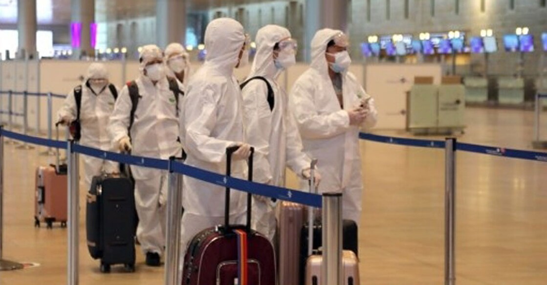 Israel: Passengers wearing protective suits and masks are seen at Ben Gurion International Airport near Tel Aviv, Israel, on Jan. 19, 2021, as Israel's cabinet decided to extend by 10 days a weeks-long nationwide lockdown to curb the spread of the COVID-19 pandemic. (Gideon Markowicz/JINI via Xinhua/ians) Israel: Passengers wearing protective suits and masks are seen at Ben Gurion International Airport near Tel Aviv, Israel, on Jan. 19, 2021, as Israel's cabinet decided to extend by 10 days a weeks-long nationwide lockdown to curb the spread of the COVID-19 pandemic. (Gideon Markowicz/JINI via Xinhua/ians)