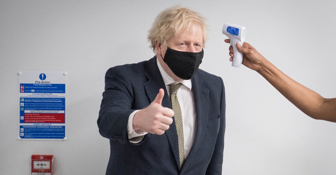 HEALTH-CORONAVIRUS-BRITAIN-VACCINE Britain's Prime Minister Boris Johnson gives a thumbs up as he has his temperature checked during a visit to Chase Farm Hospital in north London, Britain January 4, 2021. File photo: Stefan Rousseau/Pool via REUTERS