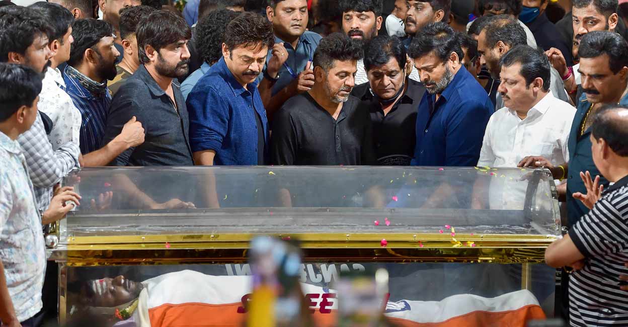 PTI10_30_2021_000221A Telugu film actors Chiranjeevi and Venkatesh with Shivarajkumar, brother of Kannada film actor Puneeth Rajkumar, after paying their respects to the mortal remains of Puneeth at the Kanteerava Stadium, in Bengaluru, Saturday, Oct. 30, 2021. Phot: PTI