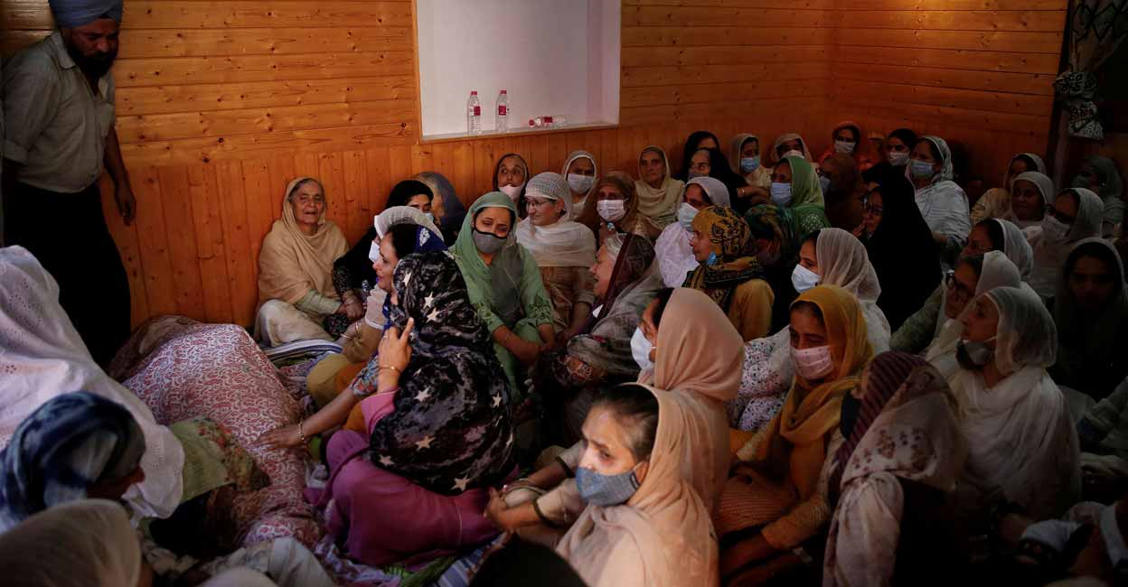 Fear prevails in Kashmir after wave of assassinations Relatives mourn around the body of Supinder Kour, a school teacher, who was shot and killed by suspected militants in Srinagar, October 7, 2021. Reuters/Danish Ismail