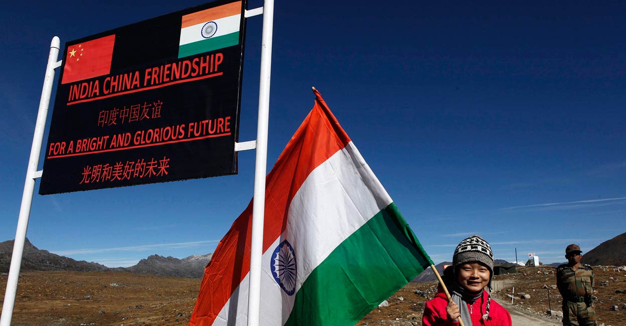 In this file photo, a girl poses for photo with an Indian flag at the Indo China border at Bumla in Arunachal Pradesh. Photo: AP/Anupam Nath