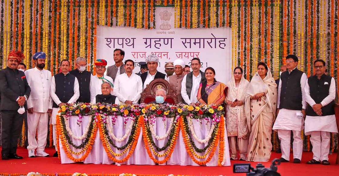 Rajasthan Chief Minister Ashok Ghelot and Rajasthan Governor Kalraj Mishra pose with new Cabinet Ministers after the swearing-in ceremony at Raj Bhawan in Jaipur, Sunday, Nov. 21, 2021. Photo: PTI