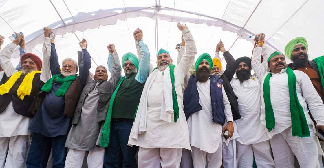 Bharatiya Kisan Union leader Rakesh Tikait and other leaders attend the 'Kisan Mahapanchayat' organised by Samyukt Kisan Morcha (SKM) at Ecogarden in Lucknow on Nov 22, 2021. Photo: PTI/Nand Kumar