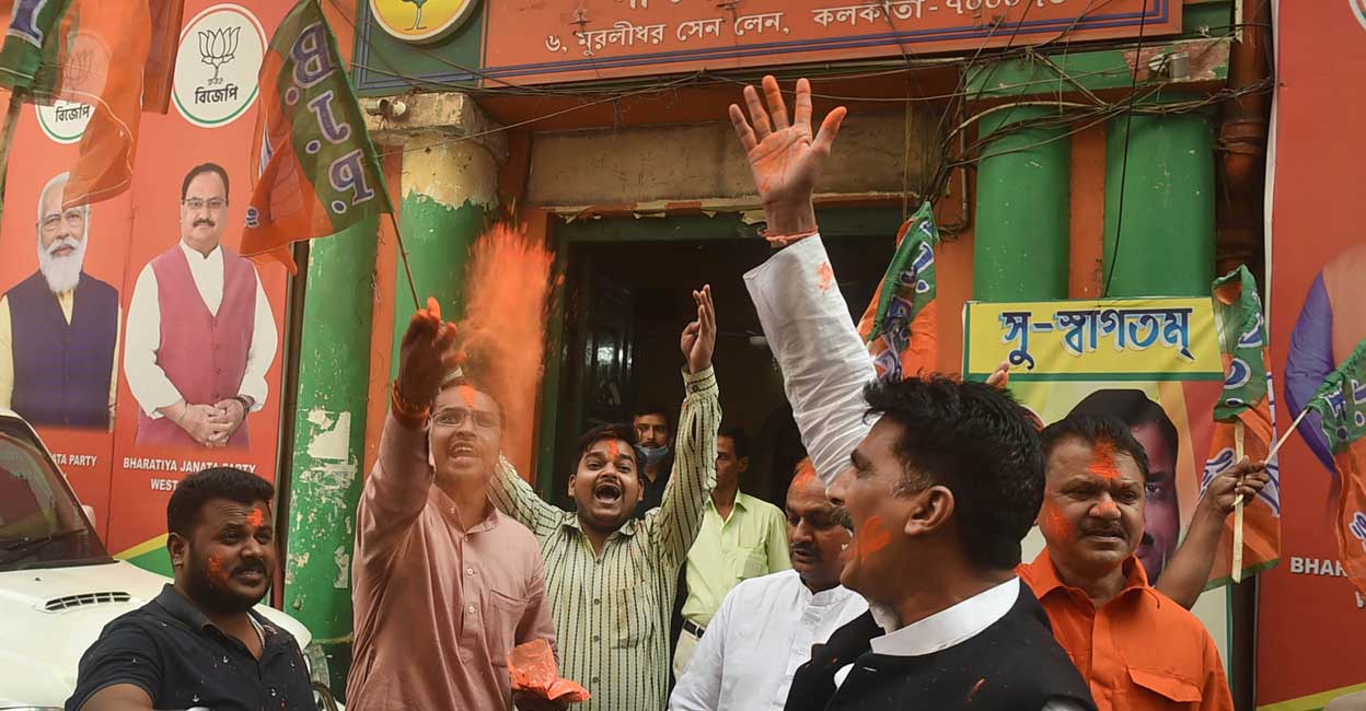 BJP activists celebrate their party BJP activists celebrate their party's victory in Tripura Municipal Elections, outside state party office in Kolkata. Photo: PTI