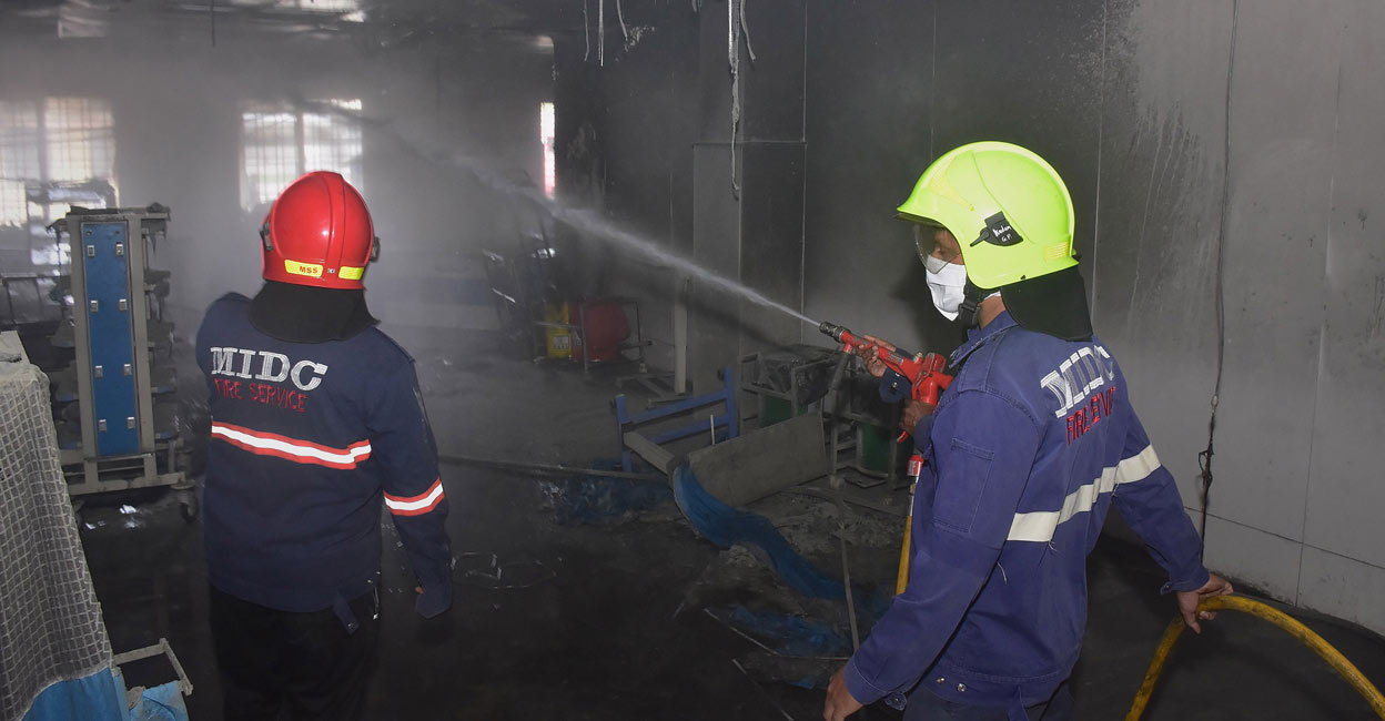 Firefighters attempt to douse the fire Firefighters attempt to douse the fire