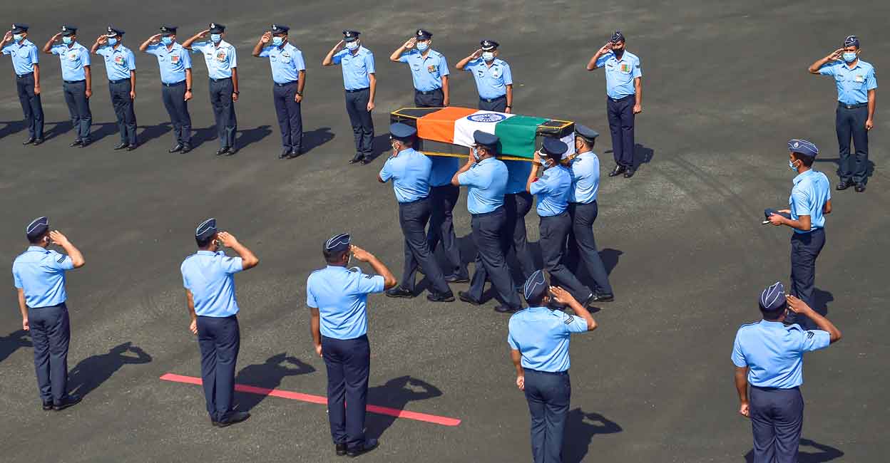 IAF chopper crash: Group Captain Varun Singh cremated with full military honours in Bhopal Indian Air Force (IAF) personnel carry the casket containing mortal remains of Group Captain Varun Singh during a wreath laying ceremony at Yelahanka Air Force station in Bengaluru, Thursday, Dec. 16, 2021. Photo: PTI/Shailendra Bhojak