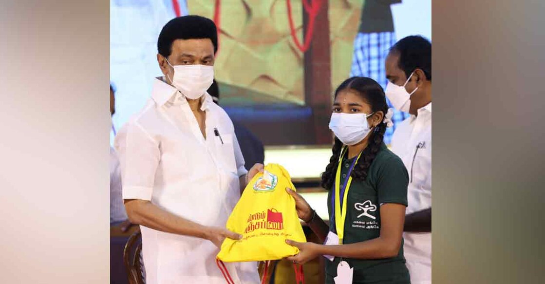 Tamil Nadu Chief Minister MK Stalin presents a cloth bag to a student. Photo: Twitter/ @mkstalin