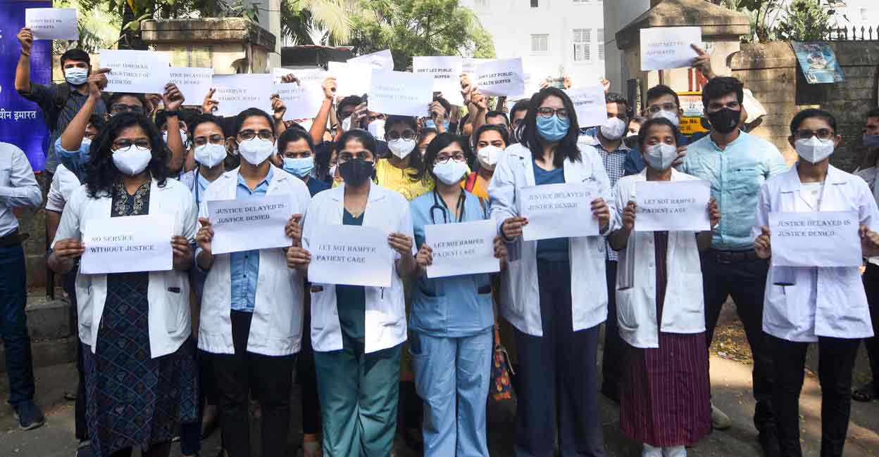 Doctors protest outside JJ hospital over the delay in NEET-PG 2021 counselling and other issues in Mumbai on Friday. Photo: PTI
