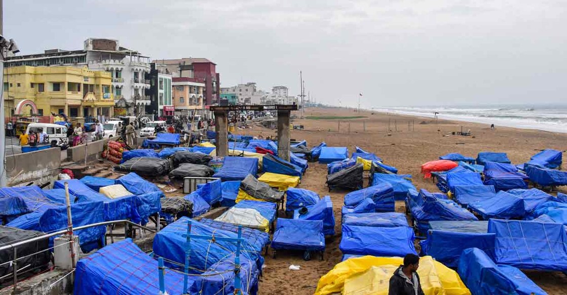 Beachside temporary shops covered by polythene sheets in the wake of Cyclone Jawad, in Puri, Odisha on Saturday. Photo: PTI