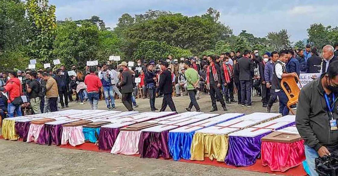 Locals at a ceremony to pay last tributes to the 13 people who were allegedly killed by Armed Forces, in Mon district on Monday. PTI