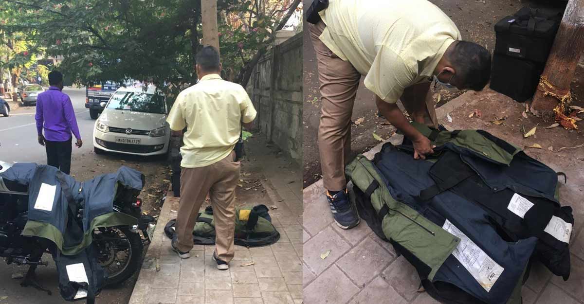 explosive experts and others are inspecting the SUV explosive experts and others are inspecting the SUV